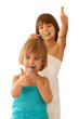 Pretty little sisters brushing their teeth isolated on white