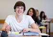 Student working on homework in classroom