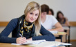 Student working on homework in classroom