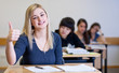 Happy Student has fun while working in classroom