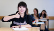 Happy Student has fun while working in classroom