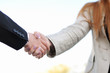 shaking hands on a light background shaking hands on a light background
