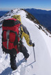 mountain climber on snowy summit. mountain climber on snowy summit.