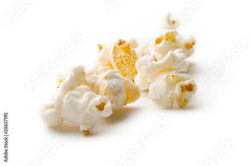Photo: Popcorn isolated on white Popcorn isolated on white