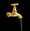 Old metal faucet and water stream isolated on black