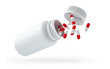 Droped white bottle with pills