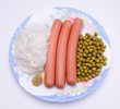 Dish with sausage, noodles and green peas Dish with sausage, noodles and green peas