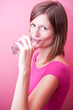 pretty, young woman drinking fresh water from a glass (color ton
