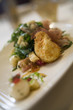 Breaded Goat Cheese on Warmed Frisee Salad