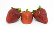 Three fresh trawberries isolated on white