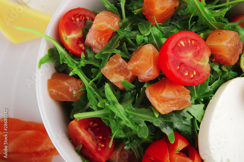Photo: salad with smoked salmon in white bowl salad with smoked salmon in white bowl