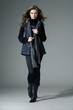 Attractive young fashion model on grey