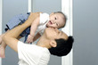 portrait of a happy young father with his cute baby