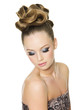 Teen girl with fashion hairstyle and glamour make-up