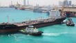 Video: two towing boats turning tanker in sea port two towing boats turning tanker in sea port