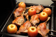 Roasted goose drumsticks in a baking oven