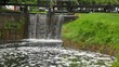 water flowing through sluice and falling water flowing through sluice and falling