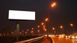 empty billboard near bridge with moving cars