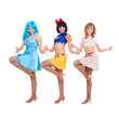 Three smiling girls dancing
