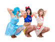Three girls dressed in doll clothes
