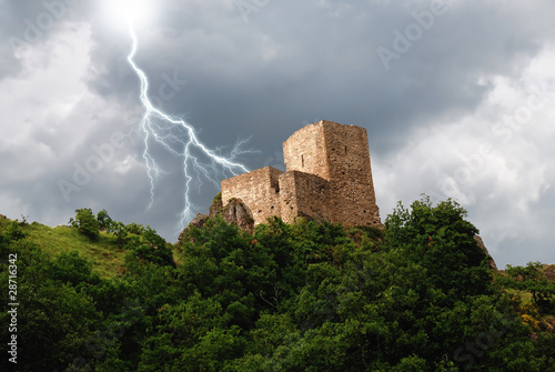 Photo: isolated tower in the forest under the lightning isolated tower in the forest under the lightning