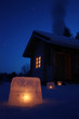 Log cabin in winter night with ice lantern decoration Log cabin in winter night with ice lantern decoration