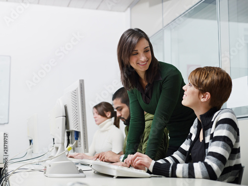 Photo: Teacher and students in computer class Teacher and students in computer class