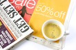 Cup of coffee on newspaper