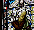 Detail of stained glass religious window in church