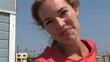 Video: Young woman leaning against lifeguard stand at beach Young woman leaning against lifeguard stand at beach