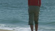 Video: Young woman at shoreline of ocean Young woman at shoreline of ocean