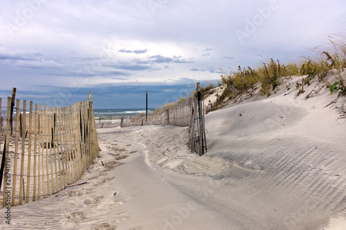 Photo: Path through sand dunes on a beach on Long Island, New York Path through sand dunes on a beach on Long Island, New York