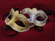 Two masquerade mask on red cusion Two masquerade mask on red cusion
