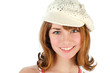 Portrait of young beautiful smiling girl in cap