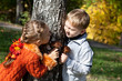 a girl and a boy are playing hide-and-seek
