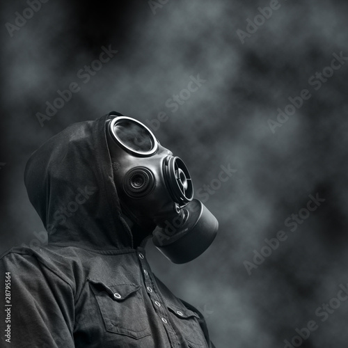 Photo: Hooded man wearing Gas mask Hooded man wearing Gas mask