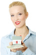 Beautiful woman holding dollar bills and house model Beautiful woman holding dollar bills and house model
