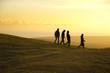 Silhouetted walkers Silhouetted walkers