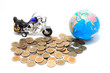 Globe and car on the pile of coins - isolated Globe and car on the pile of coins - isolated