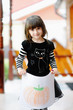 Little girl in halloween outfit shows her drawing Little girl in halloween outfit shows her drawing