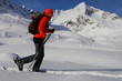 Young woman doing ski touring. Outdoor winter activity