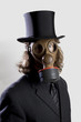 Foto: Businessman wearing a gas mask and a top hat Businessman wearing a gas mask and a top hat