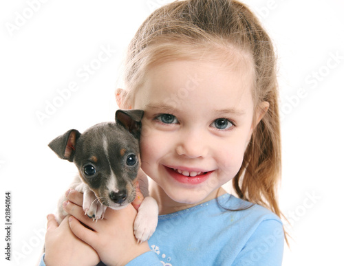 Photo: Cute girl holding a puppy Cute girl holding a puppy