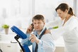 Businessman talking on phone during massage