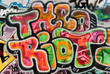 Abstract graffiti fragment on the textured brick wall