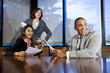 Multiracial businesspeople watching presentation