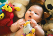 a baby surrounded by toys