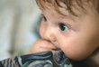 a little boy lying on sofa