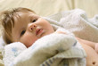 a little boy lying on sofa