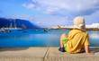 Three year old boy watching harbor in Graciosa, Canary islands Three year old boy watching harbor in Graciosa, Canary islands